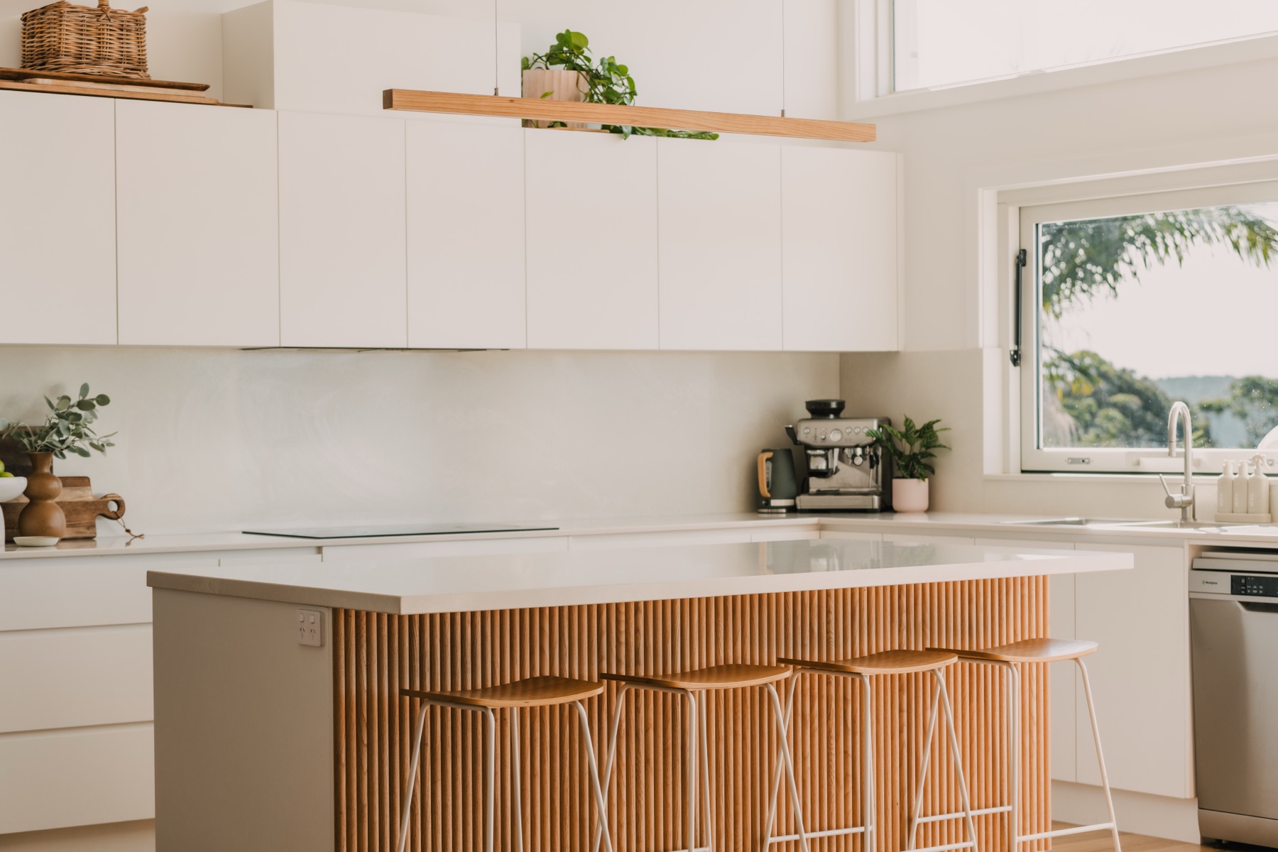 Calga Crescent kitchen with timber island and coastal view